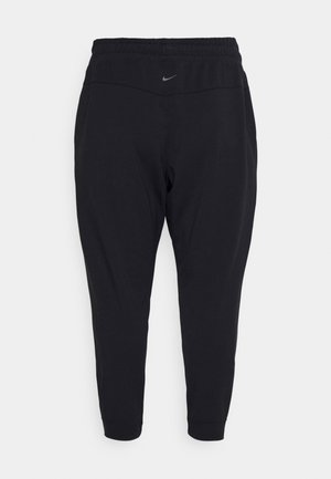 Sorte atletiske joggebukser med elastisk talje, manchetter ved anklerne og lille gråt Nike-logo foran i midten.