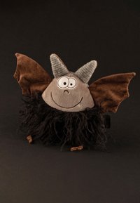 Stuffed bat toy with a round gray body, brown felt wings, pointed gray horn details, a black furry trim, and large white eyes.