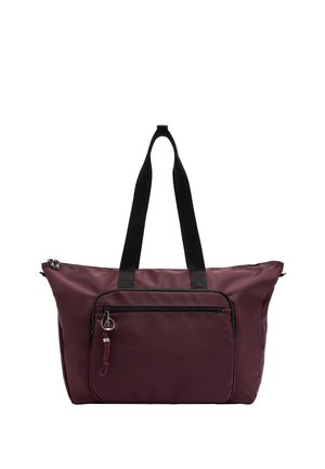 Duża bordowa torba typu tote z czarnymi uchwytami, przednią kieszenią na zamek i ozdobnym suwakiem na białym tle.