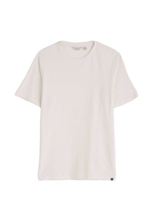Tričko s krátkym rukávom a okrúhlym výstrihom v pevnej bielej farbe, vyrobené z mäkkej bavlnenej tkaniny. Na spodnej ľavej strane je malá štítková značka s logom.