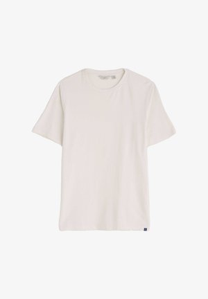 Tričko s krátkym rukávom a okrúhlym výstrihom v pevnej bielej farbe, vyrobené z mäkkej bavlnenej tkaniny. Na spodnej ľavej strane je malá štítková značka s logom.