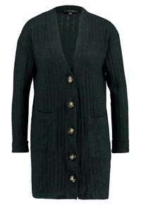 Tmavě zelený žebrovaný cardigan s hlubokým výstřihem do V, šesti knoflíky, dvěma předními kapsami a dlouhými rukávy s ohrnutými lemy. Měkká textura.