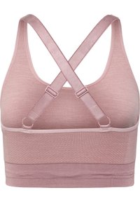 Rosa sportbh med ribbad textur, med en bred rem och korsade band. Tillverkad av stretchy tyg för komfort.