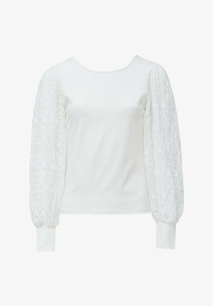 Haut à manches longues blanc avec un corps lisse ; les manches bouffantes transparentes et texturées présentent des motifs floraux brodés. Poignets à côtes aux poignets.