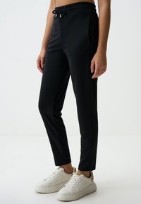 CUT HIGH WAIST - Pantalon de survêtement - black