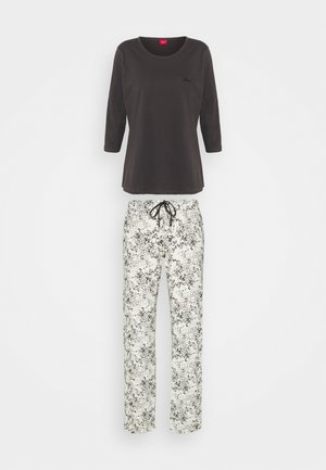 Dunkelgraues Langarmoberteil kombiniert mit weißen Hosen, die ein florales schwarzes Design aufweisen. Die Hosen haben einen Kordelzugbund und einen lockeren Schnitt.
