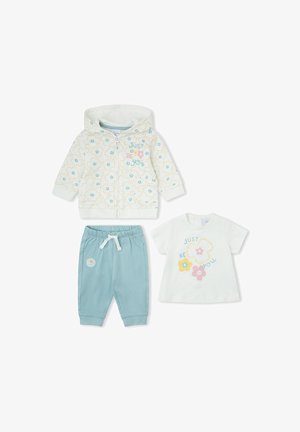 Sudadera con capucha blanca con flores y cremallera, pantalones azul claro con cordón y camiseta blanca de manga corta con "Just Be You" y diseños de flores.