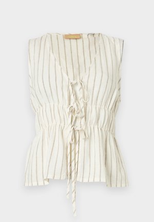 Krémová blúzka bez rukávov s hnedej vertikálnymi pruhmi, výstrih do V, zošitý pás a dva predné zaväzovacie uzly.