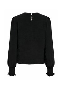Blouse noire à manches longues en tissu texturé, poignets élastiques à volants et petite fermeture à bouton avec ouverture en trou de serrure au niveau de la nuque, au dos.