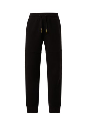 Pantalones de chándal negros con cinturilla elástica, cordón ajustable, bolsillos laterales y un diseño de pierna ajustada. Textura suave y detalle de costura mínima.