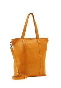 Oranssi nahkatote bag, jossa on kaksi pitkää kahvaa, irrotettava olkahihna ja pystysauma yksityiskohtia. Pehmeä pinta ja minimaalinen varustus.