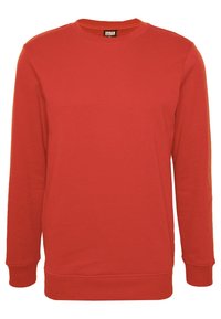 Sweat-shirt rouge à col rond en tissu mélangé de coton. Il comporte des manches longues, des poignets et un ourlet côtelés, une texture lisse, sans motifs ni accents.