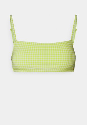 Haut de bikini à carreaux vert lime avec des fines bretelles, présentant une forme rectangulaire et un tissu lisse et extensible.