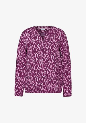 Blouse manches longues violette avec un décolleté en V et un motif léopard texturé dans des nuances plus claires de rose et de blanc.