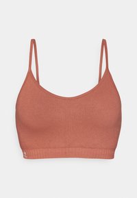 Rustfarget ribbet bralette med justerbare stropper, en glatt tekstur og en lett bølget kant med en liten logo.