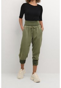 Cream Tygbyxor - green