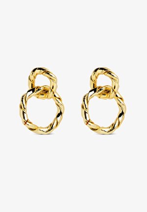 Boucles d'oreilles doubles anneaux torsadés en métal doré, avec un petit anneau relié au-dessus d'un anneau plus grand.