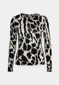 Black and white long-sleeve sweater with an abstract animal print pattern. Made from a soft fabric, features a crew neckline.