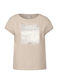 béžové tričko s krátkým rukávem s mramorovým vzorem v obdélníkovém tvaru, na kterém je nápis "NAJDI SE" a "SNÍ V JEDNODUCHÉM ZPŮSOBU."