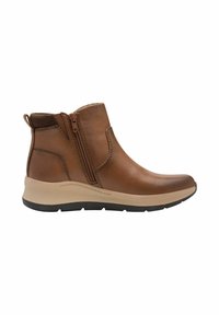 Bottes chevilles en cuir marron avec une fermeture éclair sur le côté, un bout arrondi, une semelle rembourrée beige et des détails texturés sur le dessus.