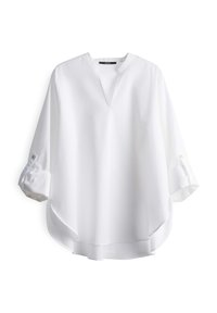 White long-sleeve blouse with a V-neck, loose fit, and rolled cuffs. Smooth fabric with a slightly shiny texture and rounded hem.