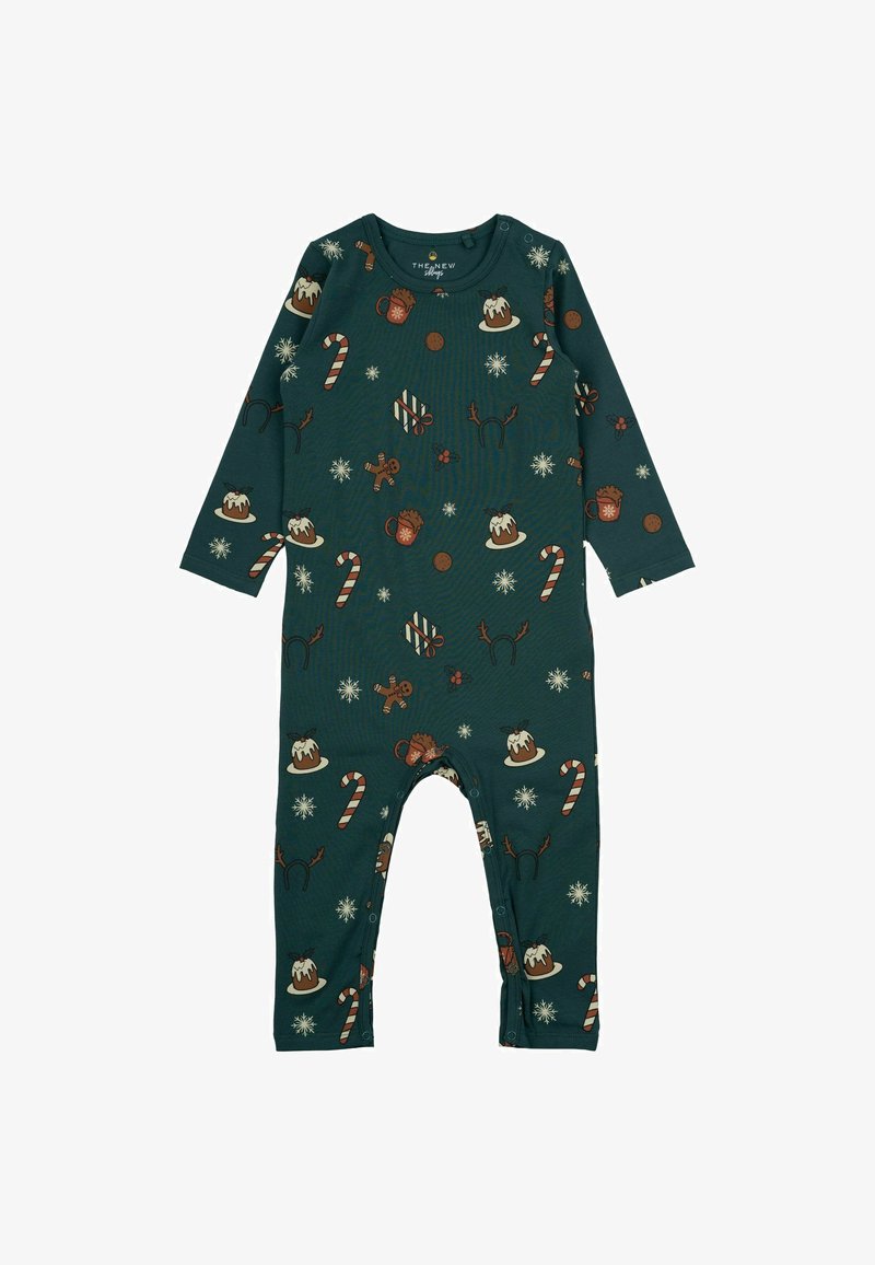 Vihreä pitkähihaisessa haalarissa on lomateemainen kuvio, jossa on piparkakku-ukkoja, karkkikeppejä ja lumihiutaleita. Se on valmistettu pehmeästä kankaasta ja siinä on nepparit.