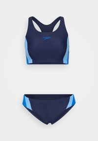 Mørkeblå sportsbikini-sett med racerback-top, lyseblå detaljer og matchende bottoms. Glatt, elastisk stoff med flate sømmer.