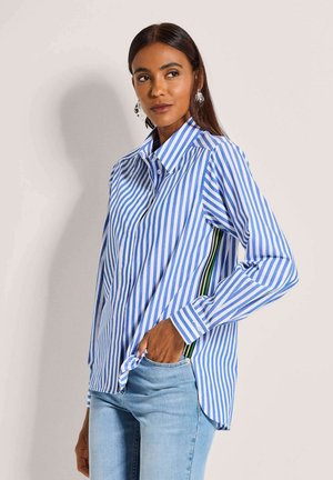 Blue and white striped button-up shirt with long sleeves, featuring a relaxed fit and side panels of green and black stripes.