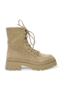 Beige suede lace-up ankle boots with a padded tongue, chunky rubber sole, and metal eyelets. Features a high, textured shaft.