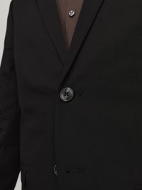 Black blazer with notched lapels, single-button closure, and textured fabric. Features a welt pocket and two black buttons.