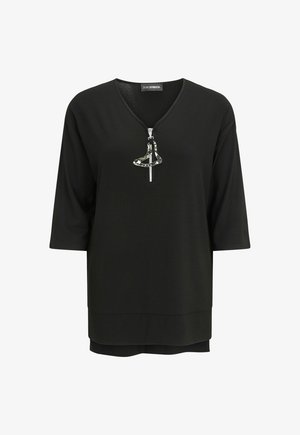 Black three-quarter sleeve top with V-neck and silver zipper pull shaped like an abstract curved form at the center front.