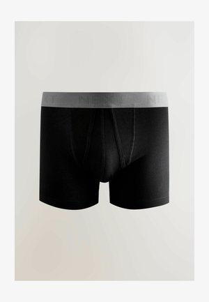 Sorte bomuldsboksershorts med en grå elastisk linning med teksten "NEXT." Skræddersyet pasform med en glat tekstur og minimale sømdetaljer.