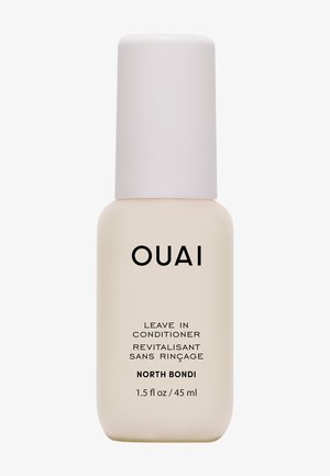 Petite bouteille beige d’après-shampoing sans rinçage OUAI North Bondi avec bouchon blanc, 1,5 onces liquides ou 45 millilitres.