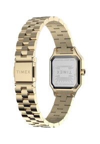 Aukso nerūdijančio plieno laikrodis su stačiakampiu ciferblatu, sujungta apyrankė ir sagtis su "TIMEX" logotipu ant juostos ir nugarėlės.