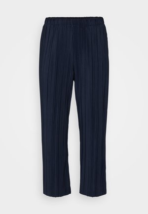 Navy pleated trousers with an elastic waistband, featuring vertical pinstripes and a relaxed fit, ending just above the ankles.