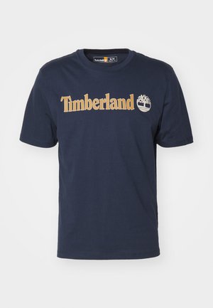 Mørkeblå bomulds t-shirt med et iøjnefaldende gult "Timberland" logo og et træ ikon, med rund hals og korte ærmer.