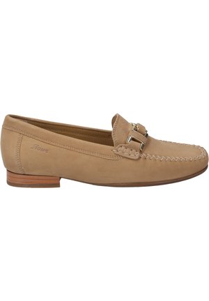 Beige suede loafers with leather trim, featuring decorative stitching and a metallic buckle accent. Low wooden heel with smooth texture.