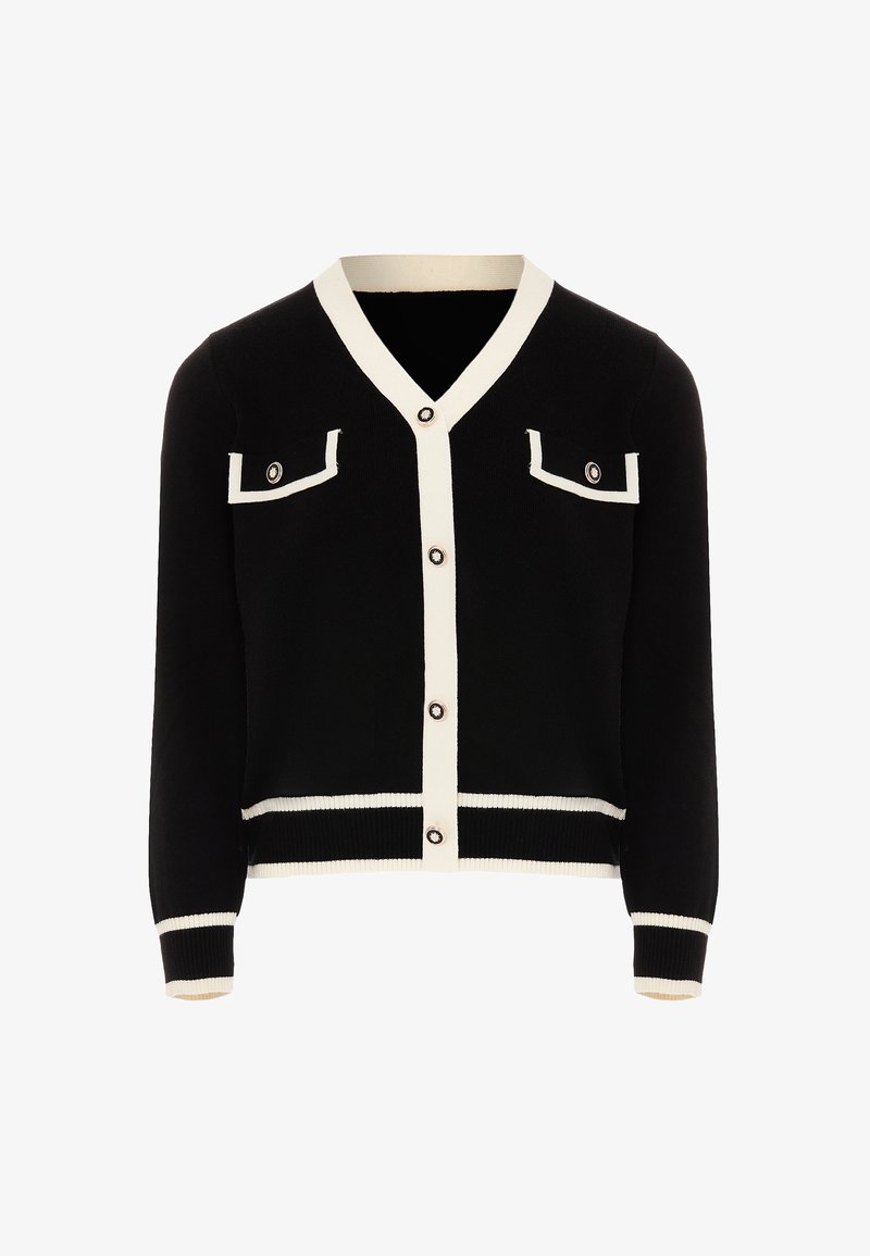 Fekete kardigán fehér díszítéssel, V-nyakkivágás, gombos záródás, két mellzseb fedővel, valamint bordázott mandzsetták és szegtés. Puha kötött anyag.