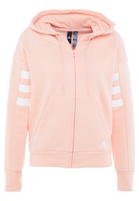 Felpa rosa chiaro con zip, dotata di cappuccio con lacci, due tasche frontali e accenti bianchi a tre strisce sulle maniche. Realizzata in tessuto morbido.