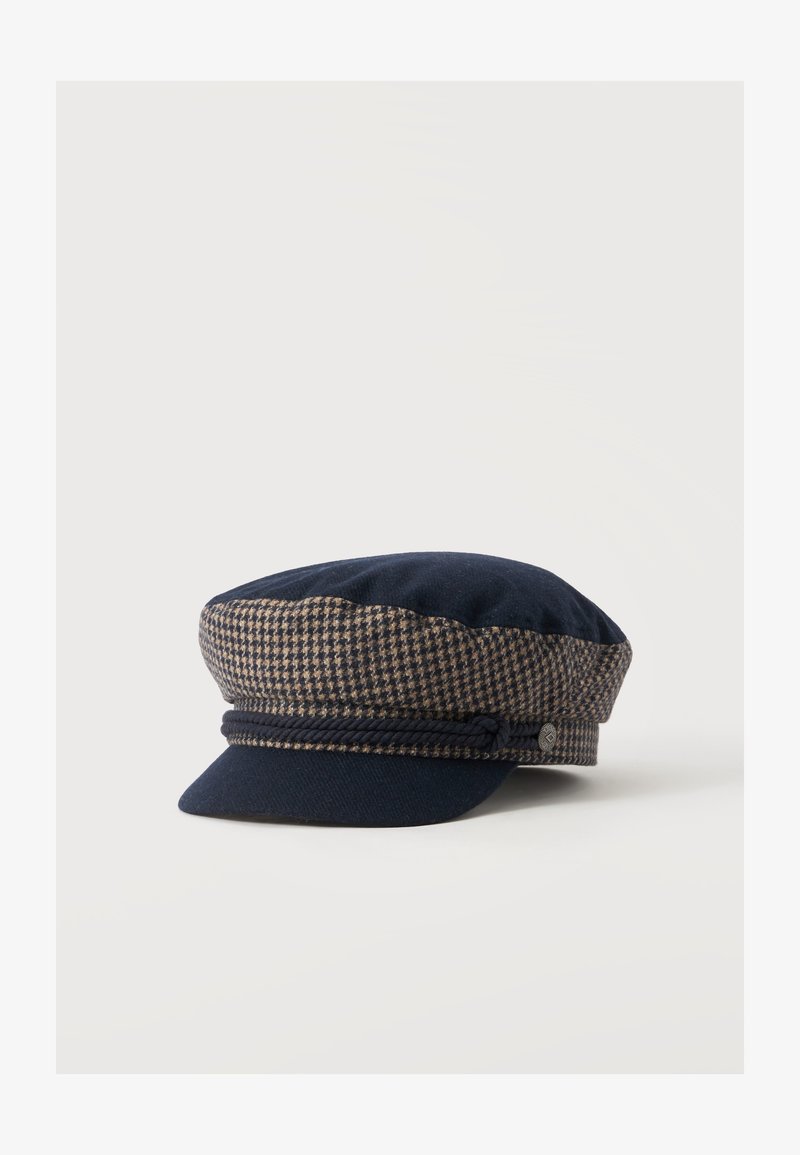 Καπέλο τύπου flat cap σε σκούρο μπλε και καφέ μοτίβο houndstooth με μικρό γείσο και διακοσμητικό σκοινί σε ναυτικό μπλε πάνω από το γείσο.