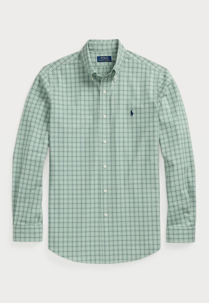 Cămașă de țesătură cu carouri verzi deschis, cu guler butonat, mâneci lungi și un accent de logo bleumarin pe piept. Material din bumbac.