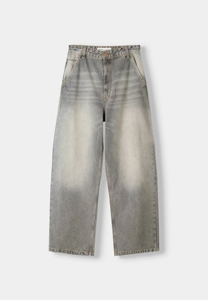 Wide-leg jeans in a light gray wash. Features a faded finish, five pockets, and a button closure. Material is soft denim.