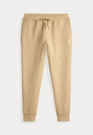 Beige slim-fit joggingbukser med snøre i taljen, sidelommer, ribbet kant og lille hvidt broderet logo på venstre lår.