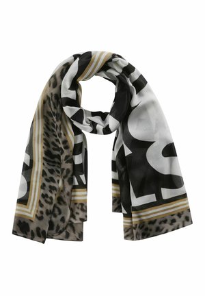 Écharpe à imprimé léopard en noir, blanc et beige, grandes lettres noires et blanches, bordure rayée beige, présentée drapée avec un nœud.