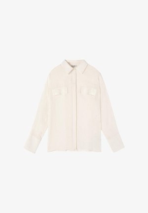 Cream-colored long-sleeve shirt with pointed collar, concealed button placket, and two chest flap pockets laid flat.