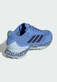 Blue athletic shoe with textured mesh upper, black three-stripe logo, and leopard-print sole. Features padded collar and lace-up design.