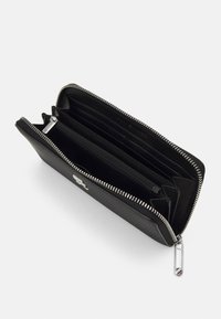 Black textured wallet with a zip closure, multiple card slots, and a central zippered compartment. Features silver-tone hardware.