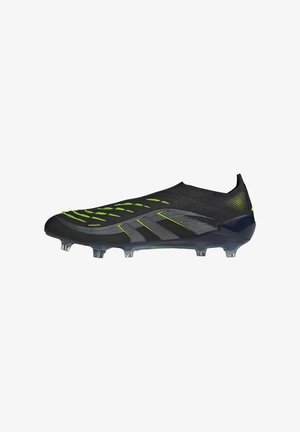 Black and neon green soccer cleat with molded studs, slip-on design, and textured surface for enhanced ball control.