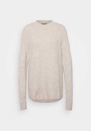 Light beige knitted sweater with a round neck, ribbed hem, and long sleeves. The fabric has a soft, textured appearance.