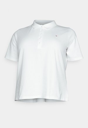 Biele polo tričko s krátkym rukávom, gombíkovou légou a malým vyšívaným logom na ľavej strane hrude.